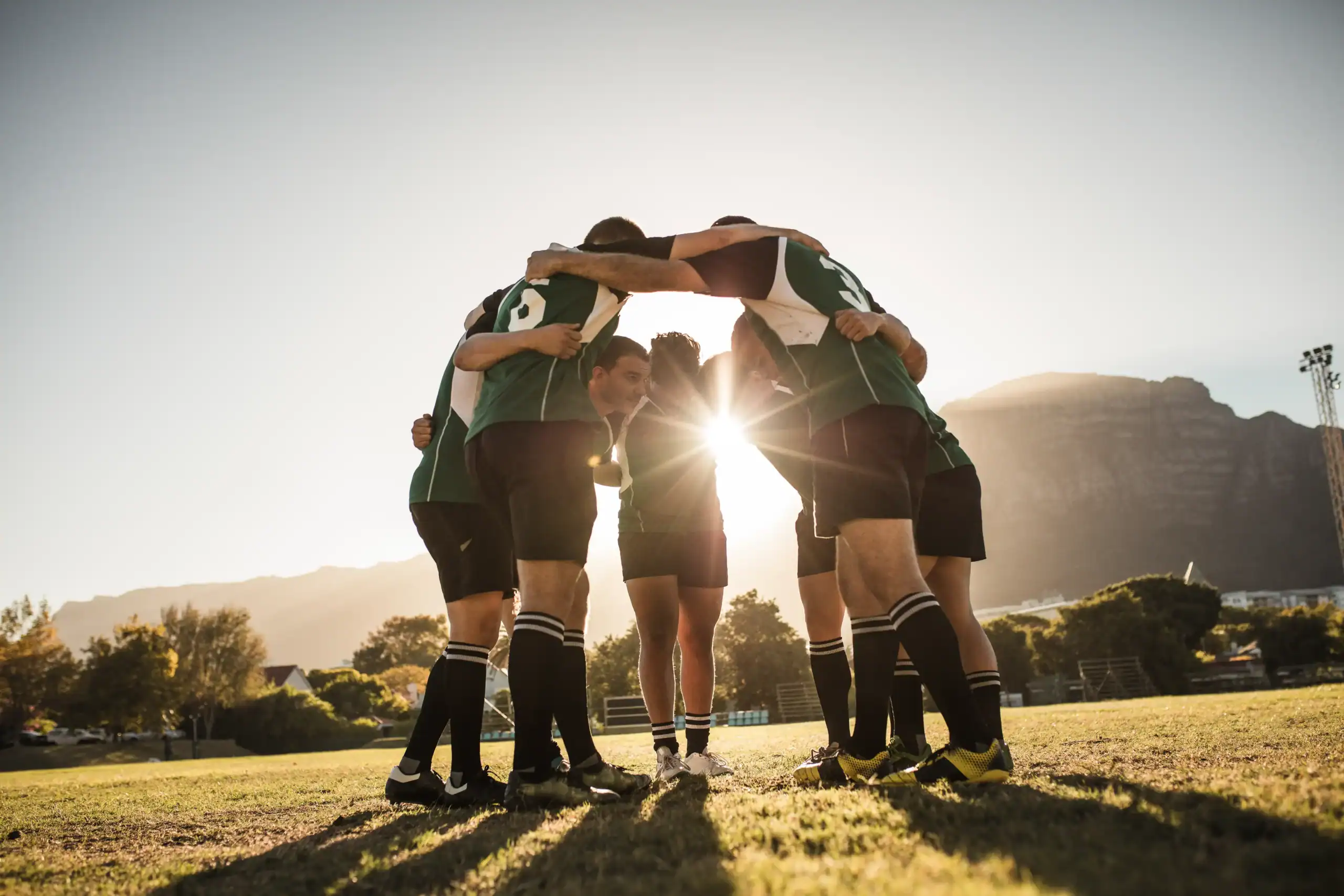 Giocatori di rugby in cerchio